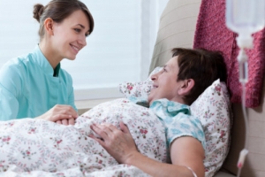 nurse and elderly woman talking